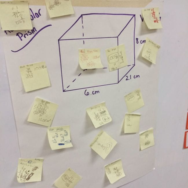 Chart showing a 3-D cube and its dimensions, with sticky notes calculating the volume added to it