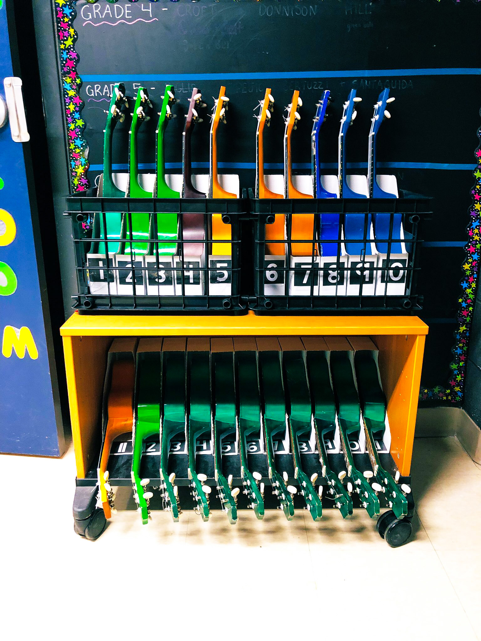 Several magazine files are shown in an orderly fashion on a shelf in an ikea classroom.
