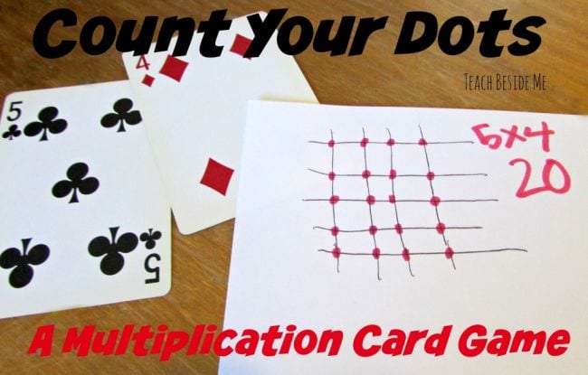 Two playing cards and a score sheet for the multiplication card game Count Your Dots