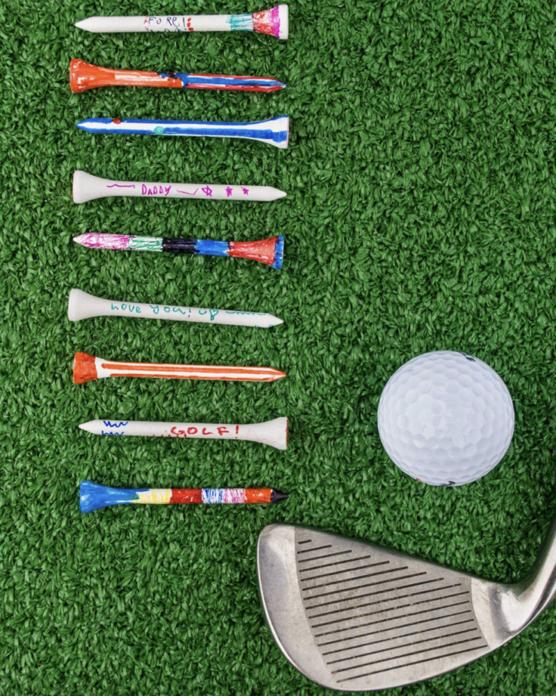 Several painted tees are shown. A golf club and ball are also shown in this example of Father's Day crafts for kids.